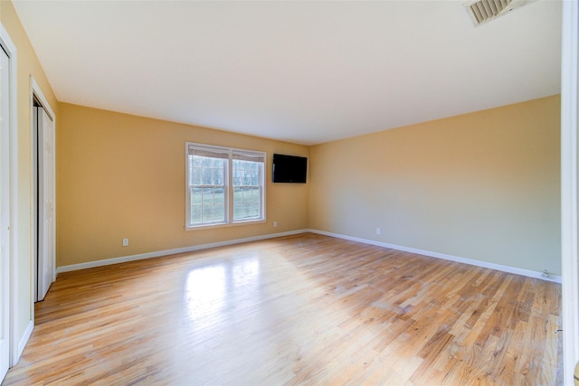 unfurnished room featuring light wood-type flooring