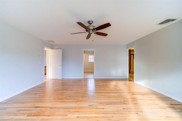 empty room featuring ceiling fan and light wood-type flooring