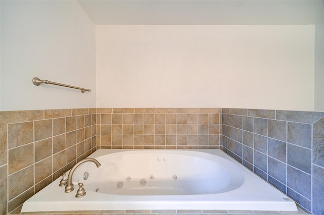 bathroom with tiled bath