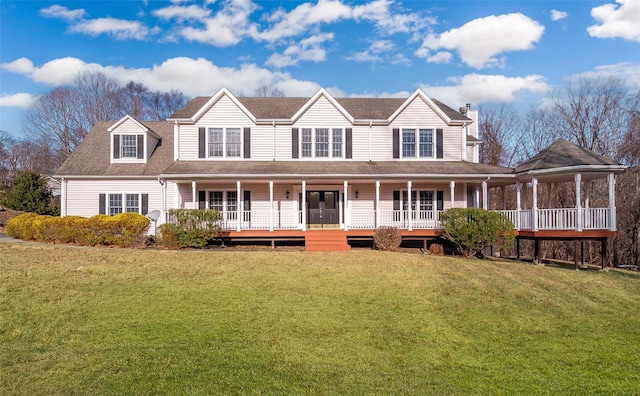 view of front of house with a front yard and a porch