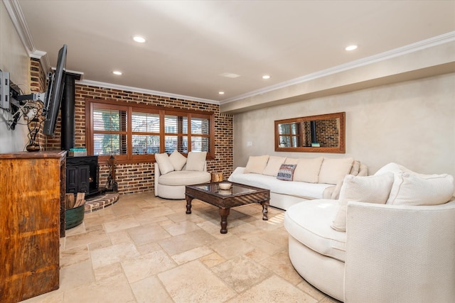 living room with brick wall, ornamental molding, and a wood stove