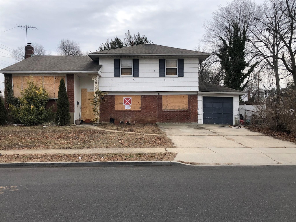 split level home featuring a garage