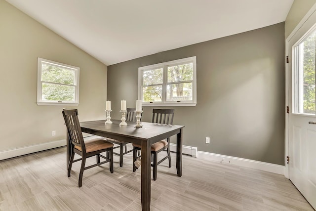 dining room with lofted ceiling