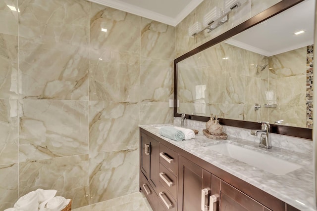 bathroom featuring vanity, tile walls, and ornamental molding