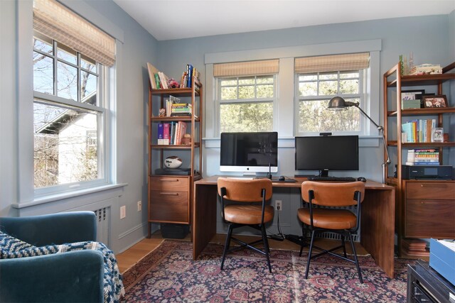 office space with wood finished floors