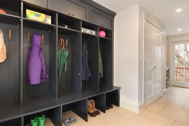 mudroom featuring tile patterned flooring, baseboards, and recessed lighting