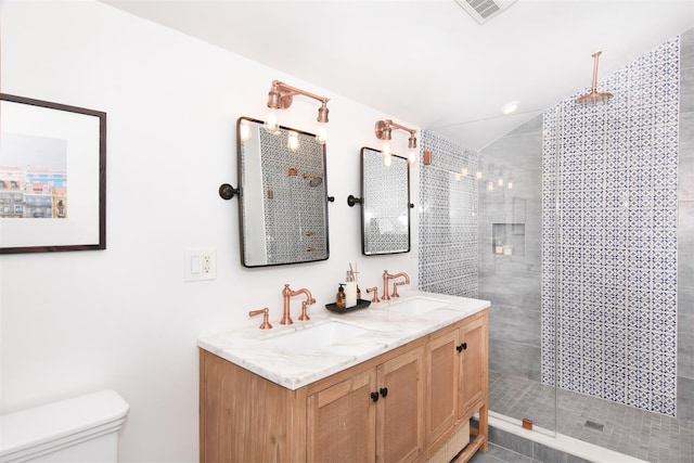 full bath featuring visible vents, walk in shower, a sink, and toilet