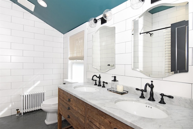 full bathroom with a sink, tile walls, and radiator