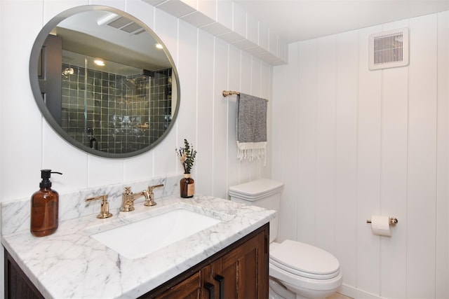 full bath with tasteful backsplash, visible vents, toilet, vanity, and a shower stall