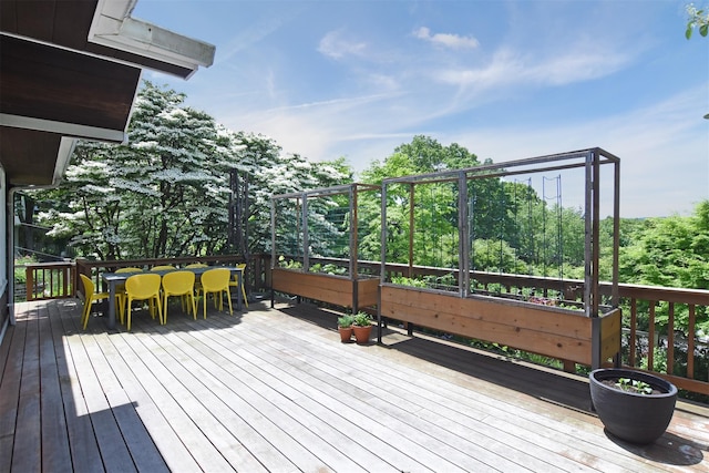 wooden deck with outdoor dining area