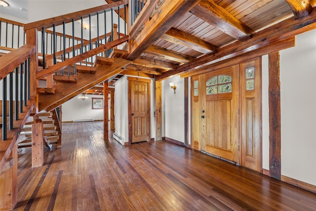 entrance foyer with beam ceiling, dark wood-type flooring, a baseboard radiator, and wooden ceiling