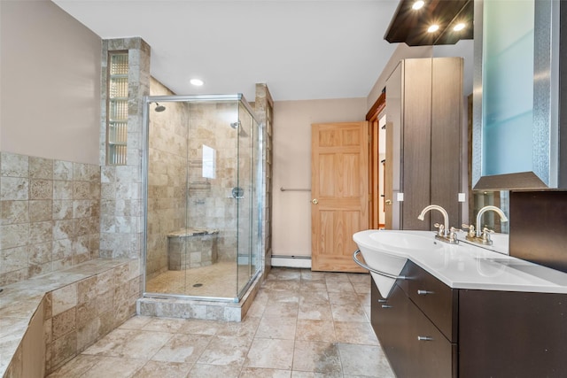 bathroom featuring a baseboard heating unit, sink, and walk in shower