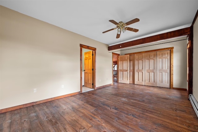 unfurnished bedroom with dark hardwood / wood-style floors and baseboard heating