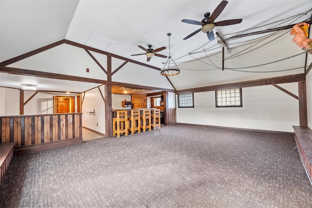 carpeted empty room featuring vaulted ceiling