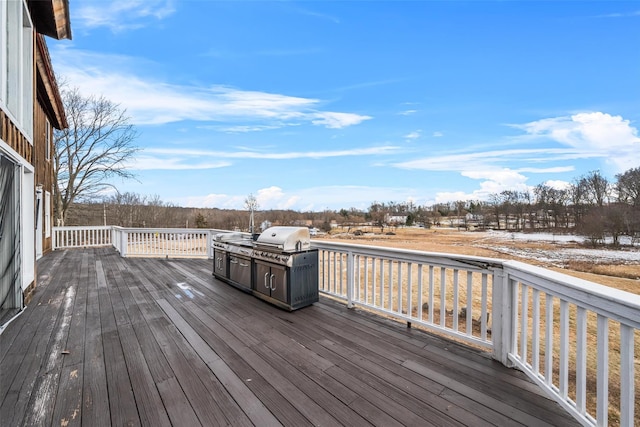 wooden terrace featuring grilling area