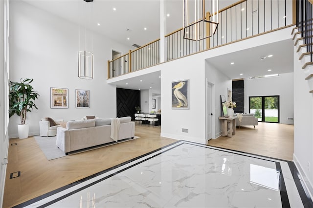 living room featuring a high ceiling