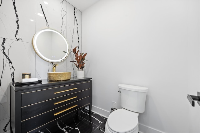 bathroom with toilet and vanity