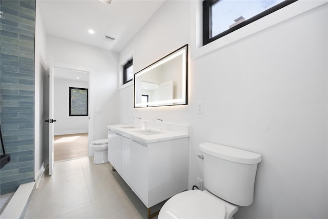 bathroom with toilet and vanity