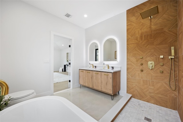 bathroom featuring toilet and vanity