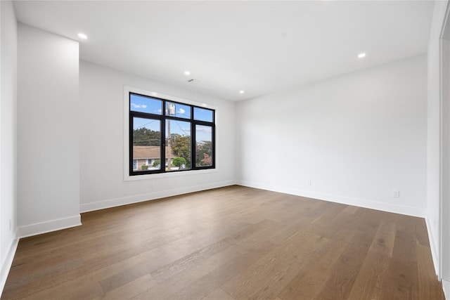 empty room featuring hardwood / wood-style flooring