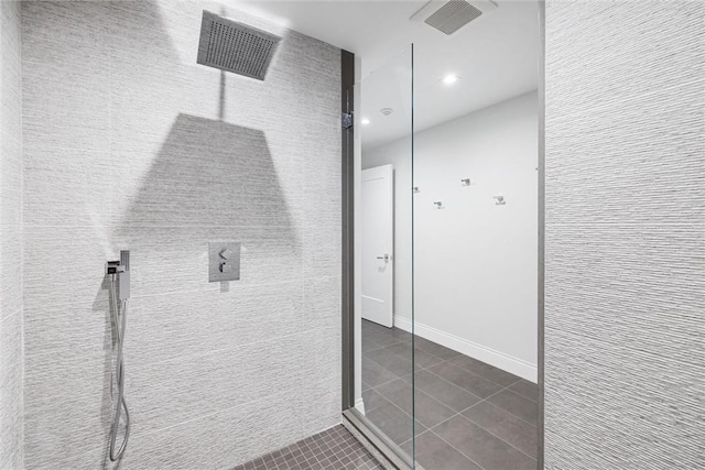 bathroom featuring tile patterned flooring and a shower