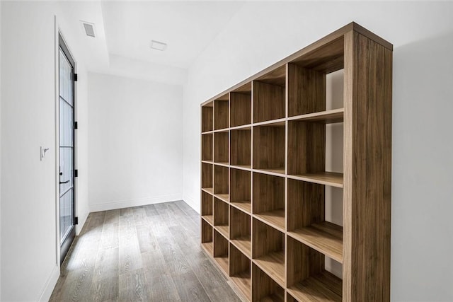 hallway with wood-type flooring