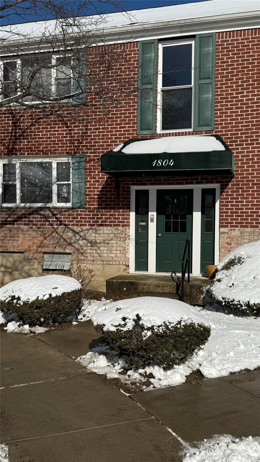 view of snow covered property entrance