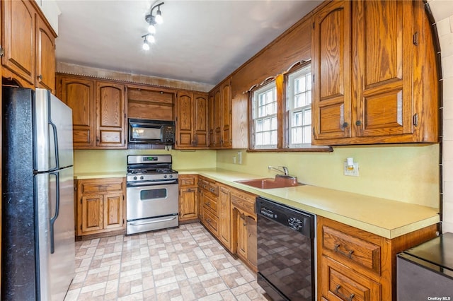 kitchen featuring black appliances and sink