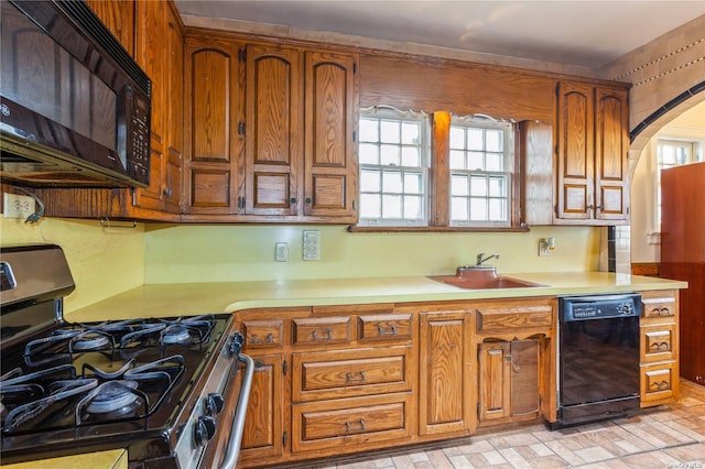 kitchen featuring black appliances and sink