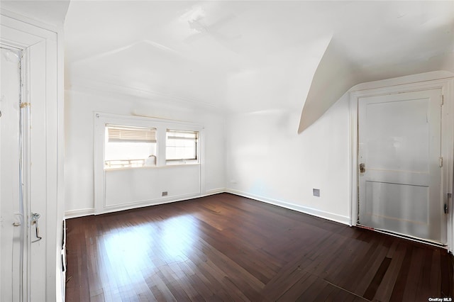 bonus room featuring vaulted ceiling and dark hardwood / wood-style floors