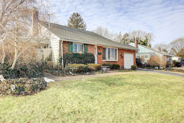 ranch-style house with a garage and a front lawn