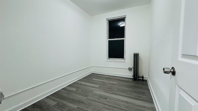 empty room featuring dark wood-type flooring