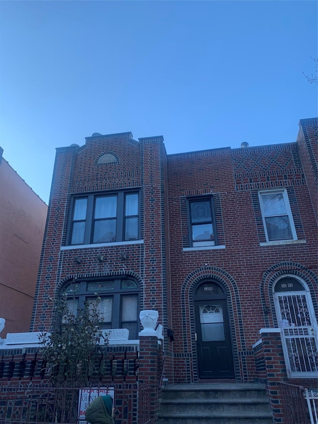 view of front of home with brick siding