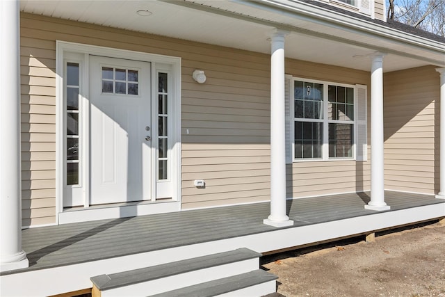 doorway to property featuring covered porch