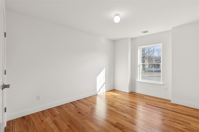 spare room featuring light hardwood / wood-style floors