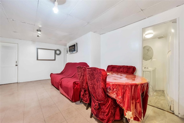 home theater room with a paneled ceiling