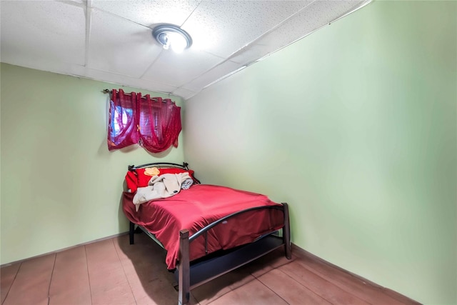 bedroom with a paneled ceiling