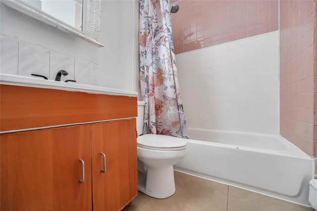 bathroom featuring toilet, tile patterned flooring, and shower / tub combo with curtain