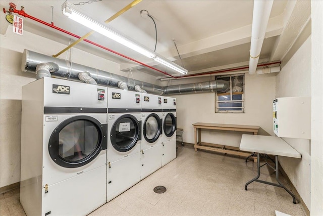 washroom with washer and dryer