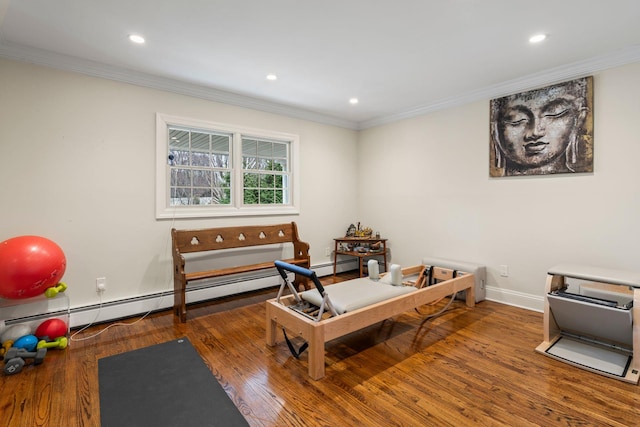 office area with dark wood-type flooring, a baseboard heating unit, and ornamental molding