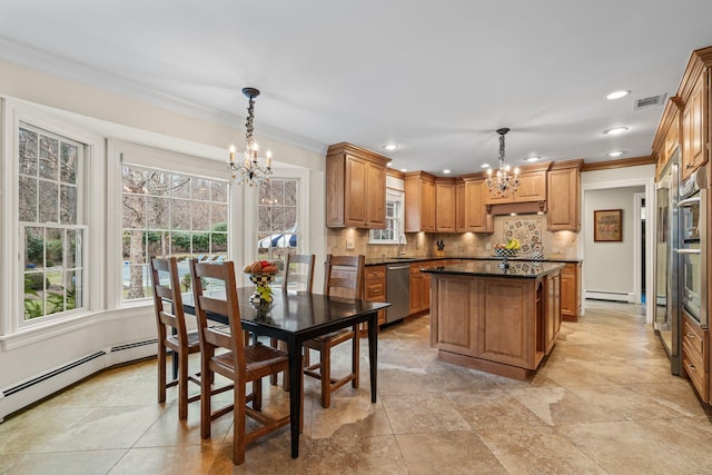 kitchen featuring decorative light fixtures, stainless steel dishwasher, and an inviting chandelier