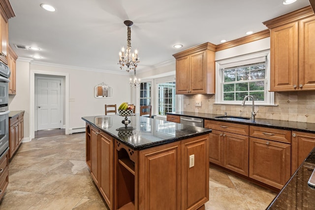 kitchen with decorative light fixtures, a center island, sink, an inviting chandelier, and a baseboard radiator