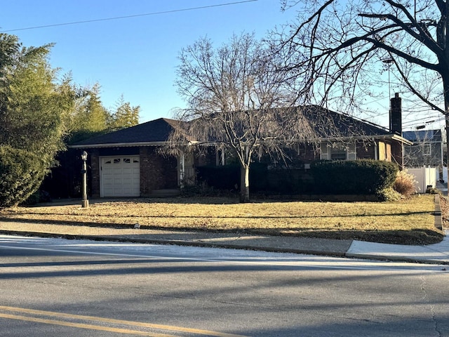 ranch-style home with a garage