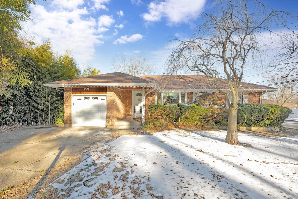 ranch-style home featuring a garage