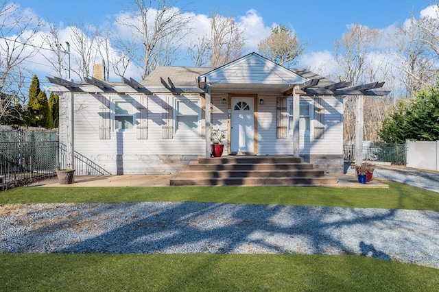 view of front of house with a pergola