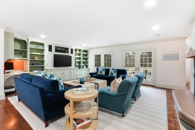 living room featuring light wood-type flooring, crown molding, french doors, and a baseboard radiator