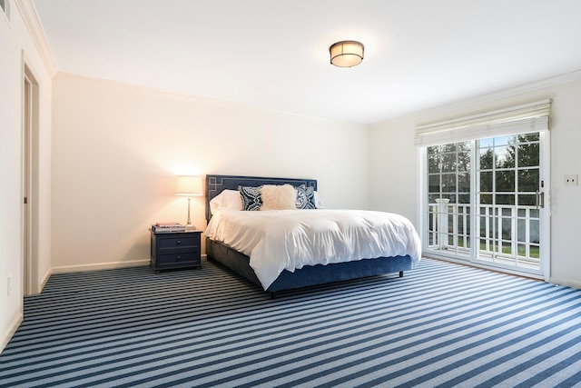 bedroom with crown molding and dark carpet