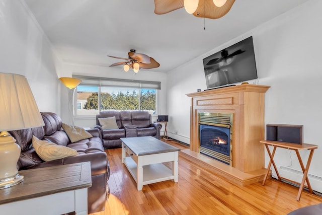 living room with hardwood / wood-style flooring and ceiling fan