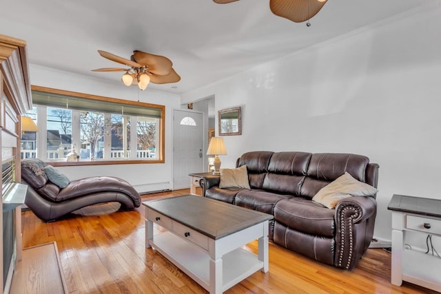 living room featuring light hardwood / wood-style flooring and ceiling fan