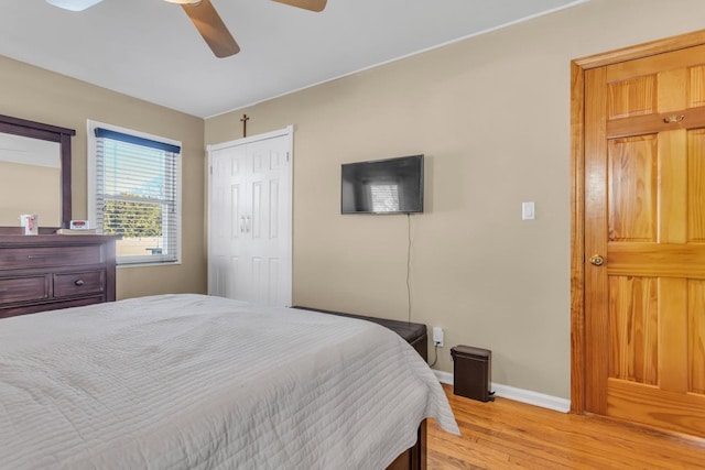 bedroom featuring a closet, ceiling fan, and light hardwood / wood-style floors